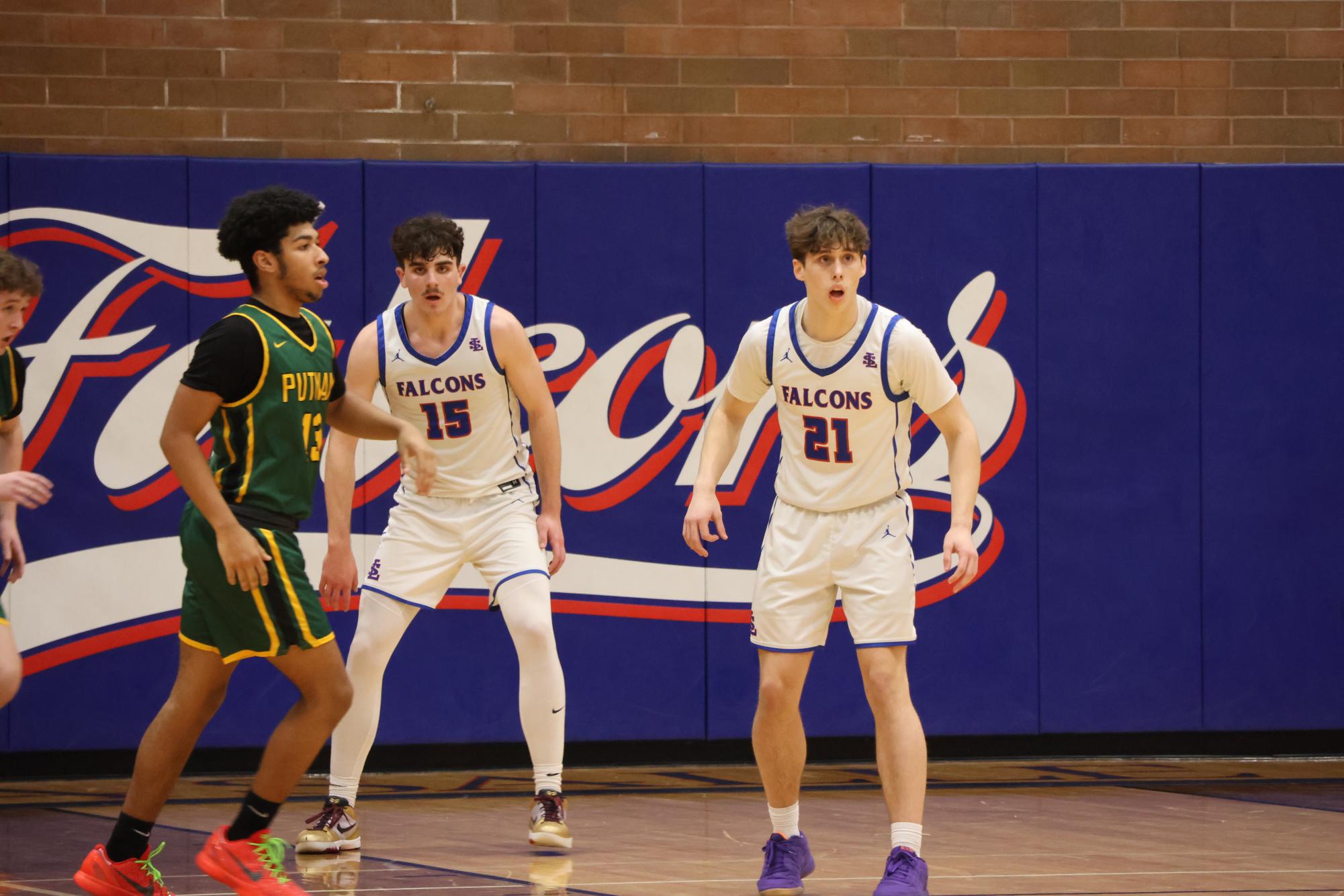 Photo Story: Boys Basketball Defends the Nest Against Rex Putnam