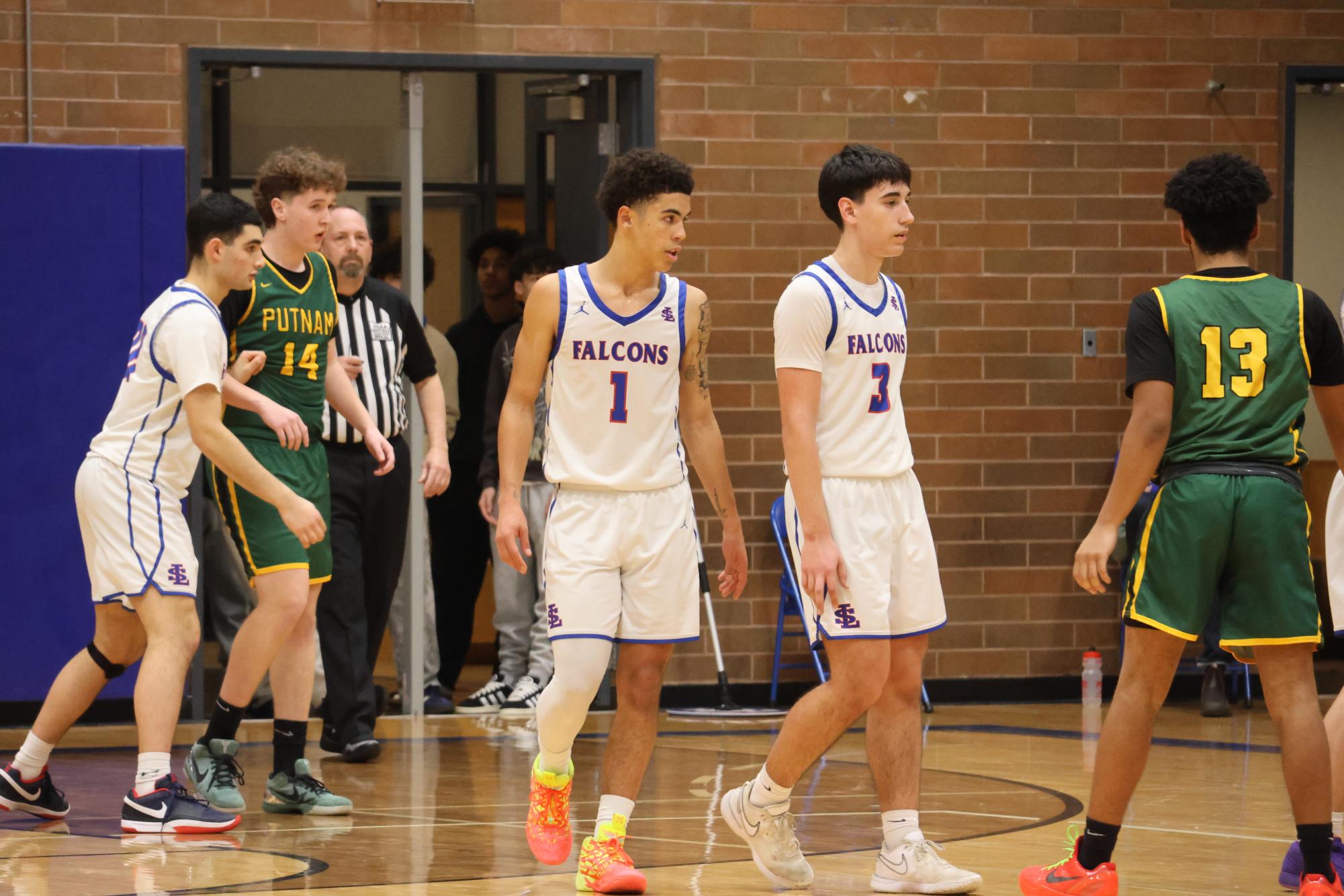 Photo Story: Boys Basketball Defends the Nest Against Rex Putnam