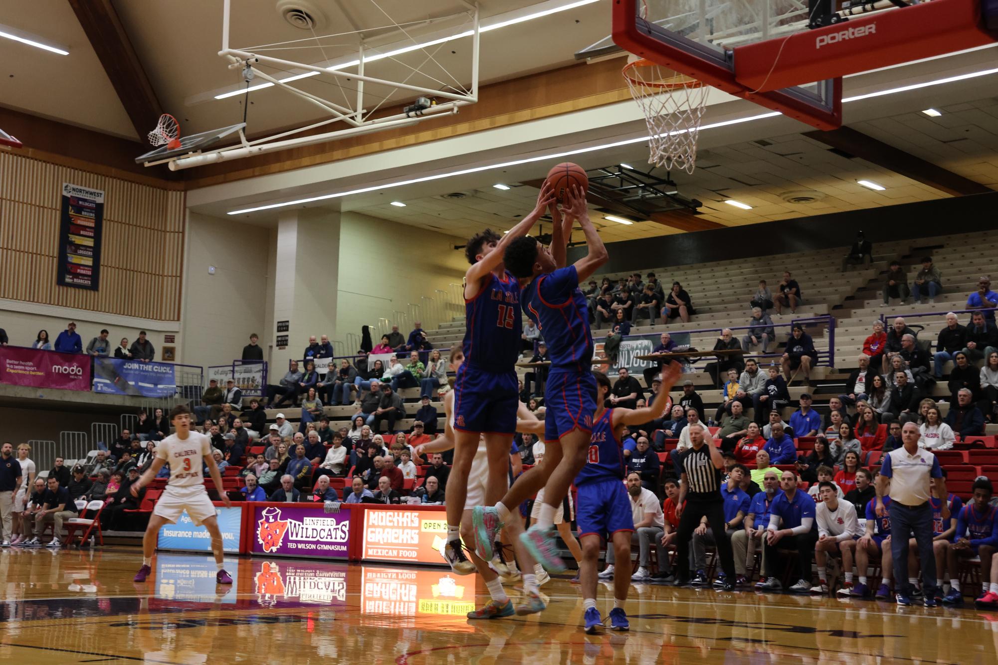 Photo Story: Falcons' Boys Basketball Fly Past First Seed Caldera