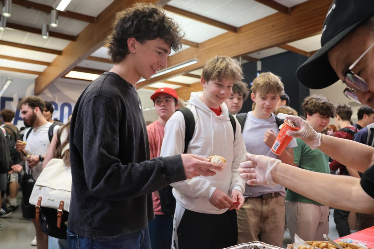 Volunteers brought and handed out portions of food for Falcons to try.