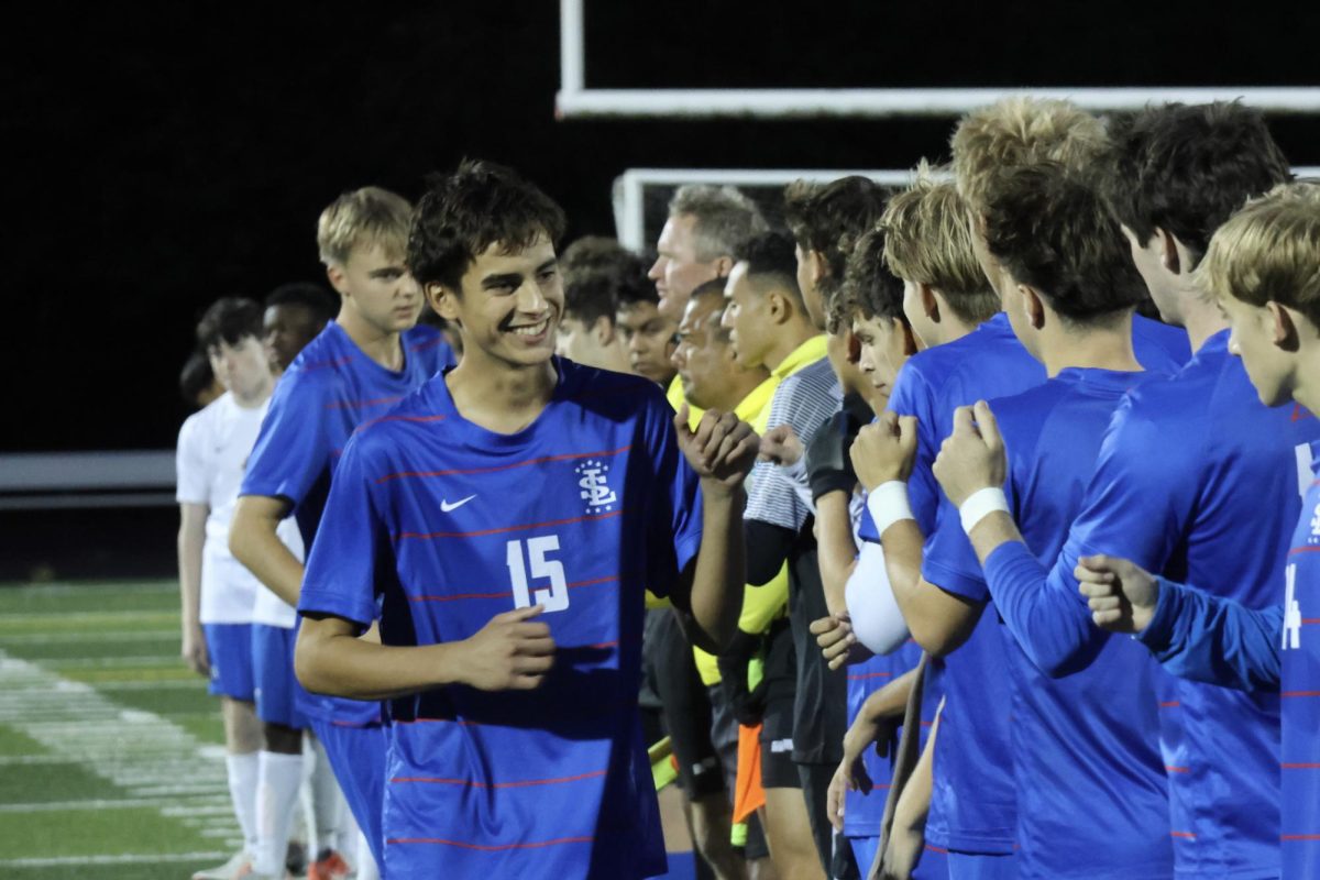 Sophomore Luke Herrera, number 15, has only been playing football for a month, but has been on the varsity boys soccer team since his freshman year.