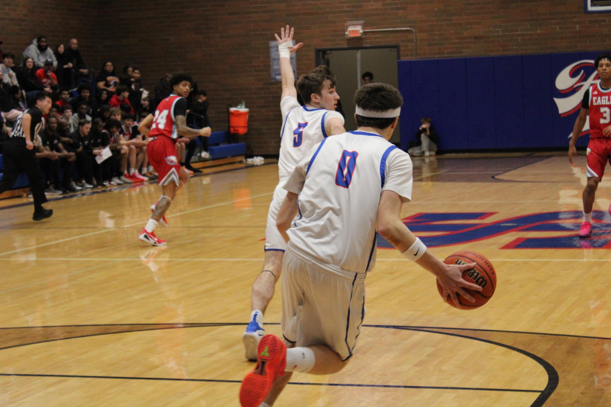 Photo Story: Falcons Varsity Boys Basketball Fall Short 54–36 Against Centennial