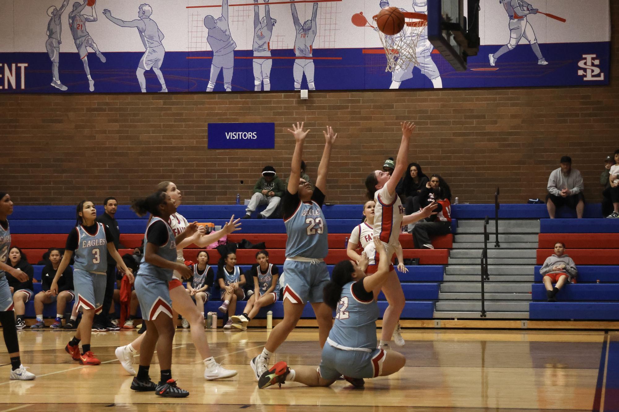 Photo Story: Falcons Girls Basketball Steamroll Eagles 61-28 at Home