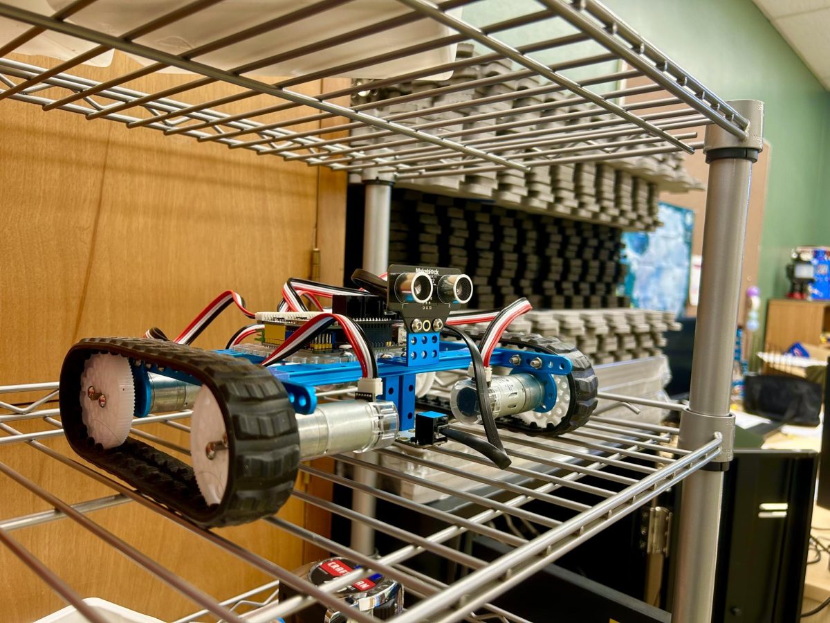 Sophomores Max Elliott and Leo Goldman built this robot to participate in what the class called the “Robot Olympics,” a small, end-of-year competition divided into three parts. This specific robot was inspired by the base model they assembled at the beginning of the semester, except that it was given one motor per wheel and extended in size, with the addition of an ultrasonic and line-follower sensor.