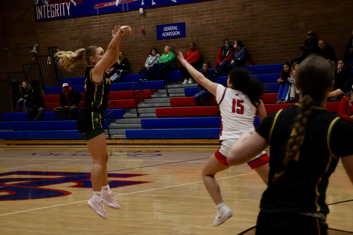 Photo Story: Girls Basketball Rolls Past Rex Putnam in 52–34 Victory
