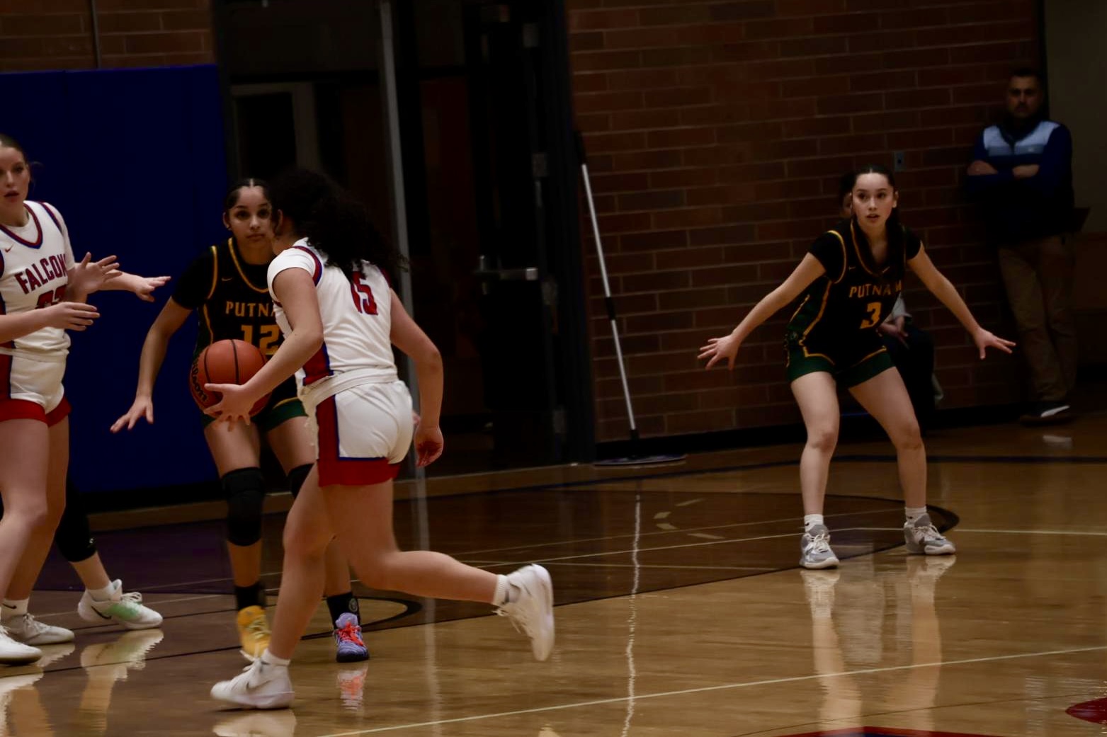 Photo Story: Girls Basketball Rolls Past Rex Putnam in 52–34 Victory