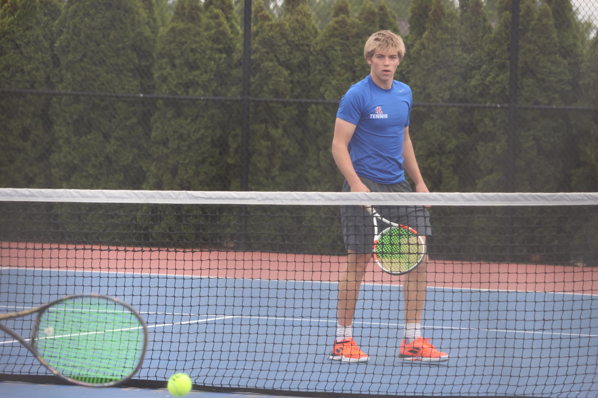 Photo Story: Boys Varsity Tennis Remains Undefeated in League, Winning Against Centennial High School