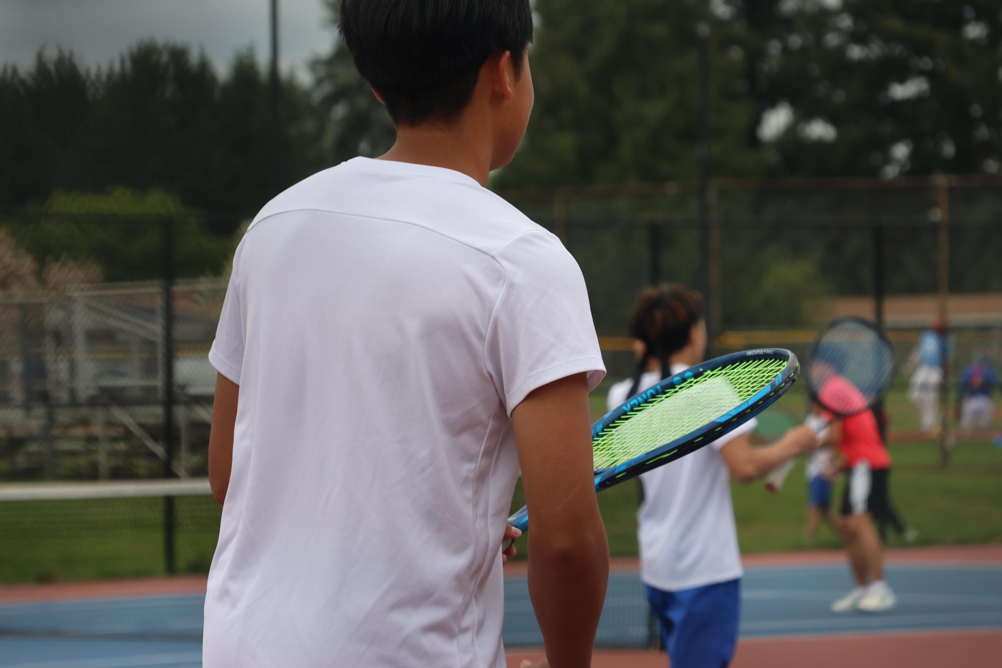 Photo Story: Boys Varsity Tennis Remains Undefeated in League, Winning Against Centennial High School