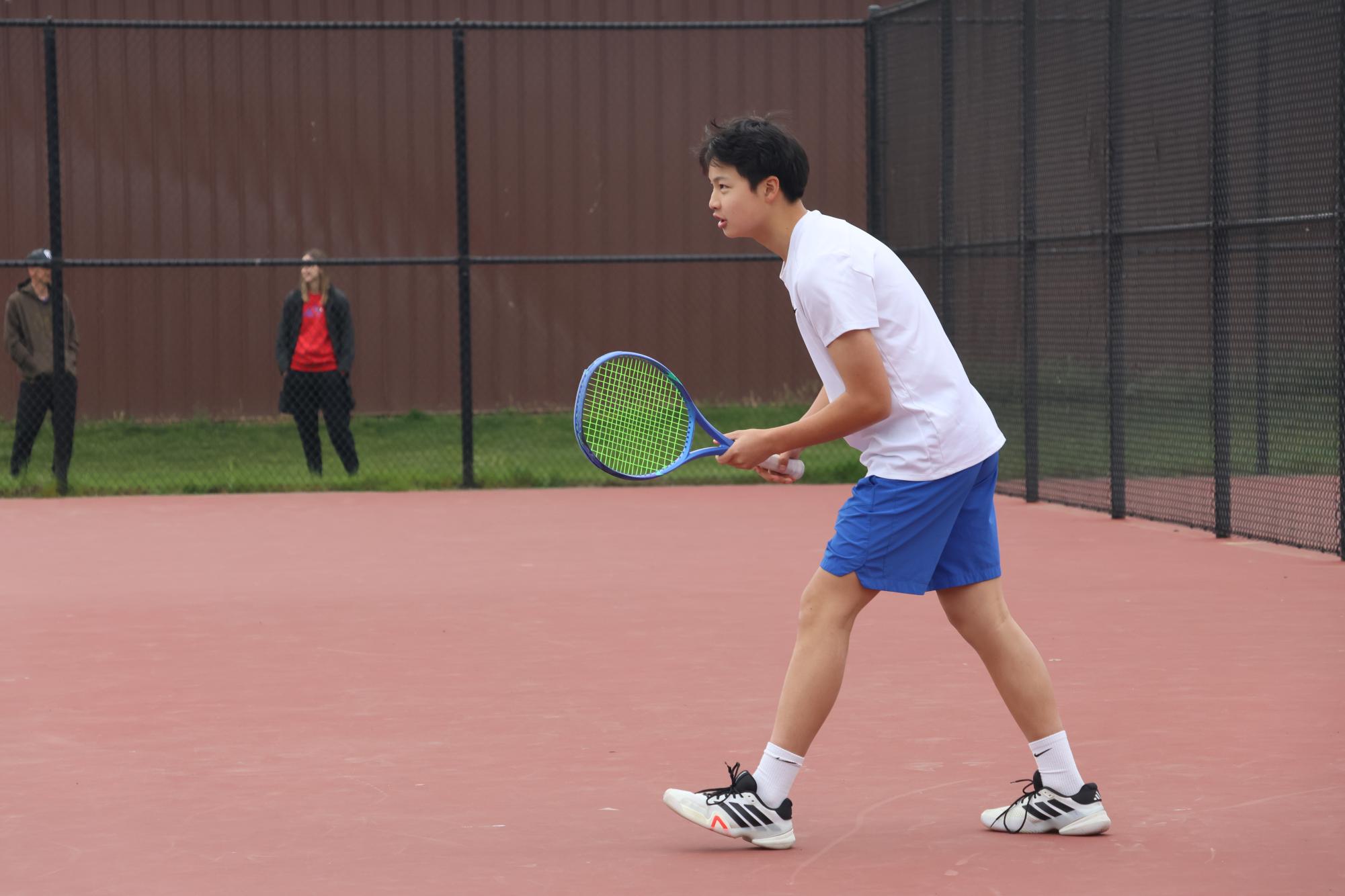 Photo Story: Boys Varsity Tennis Remains Undefeated in League, Winning Against Centennial High School