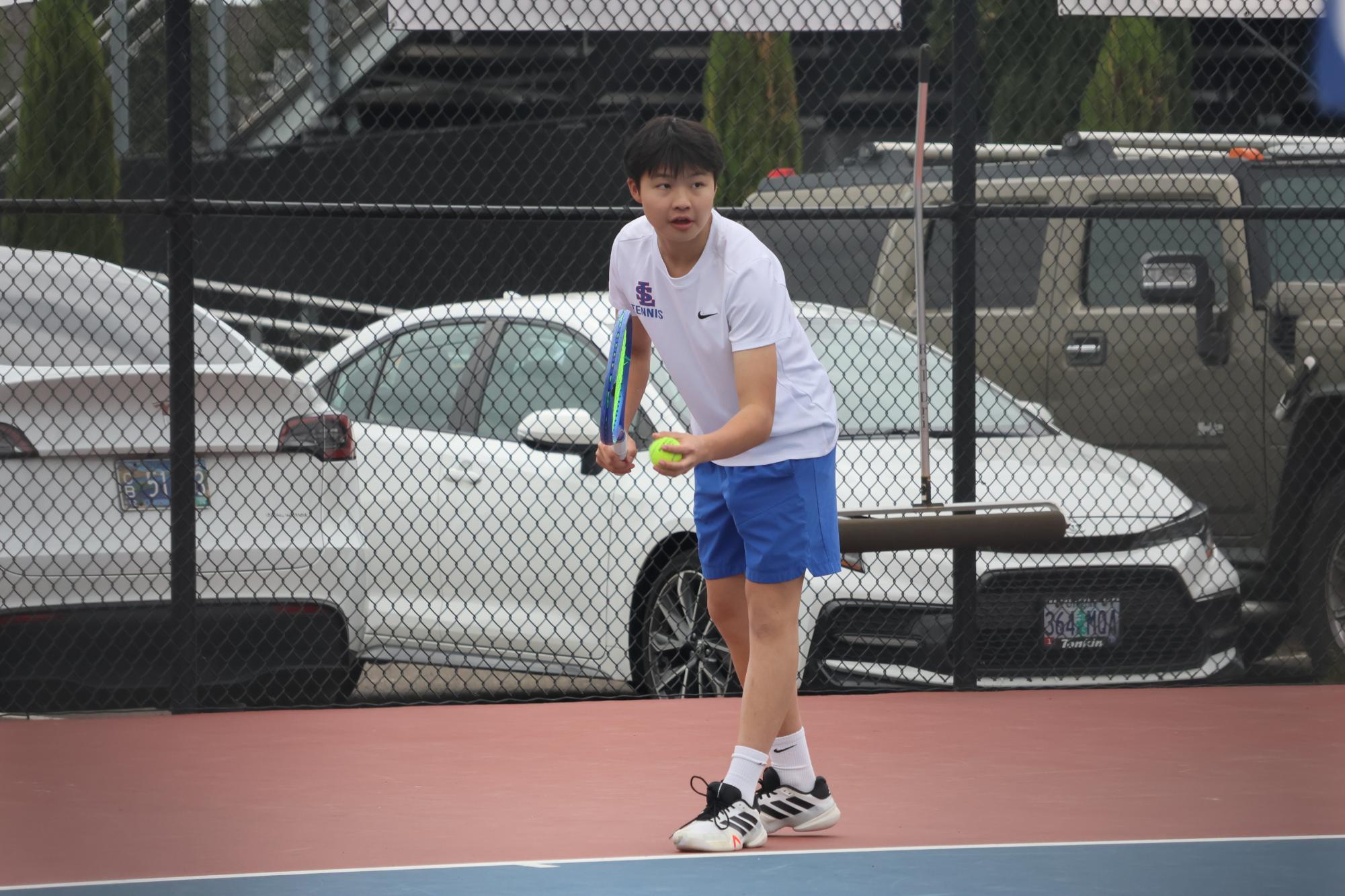 Photo Story: Boys Varsity Tennis Remains Undefeated in League, Winning Against Centennial High School