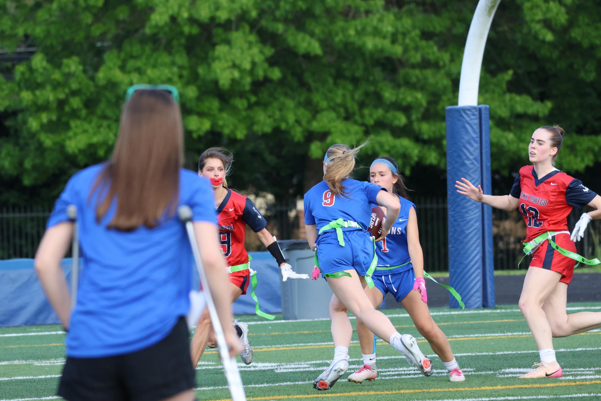 Photo Story: Girls Flag Football Team Sweeps Aside Lakers 13-6 in First Game of Doubleheader
