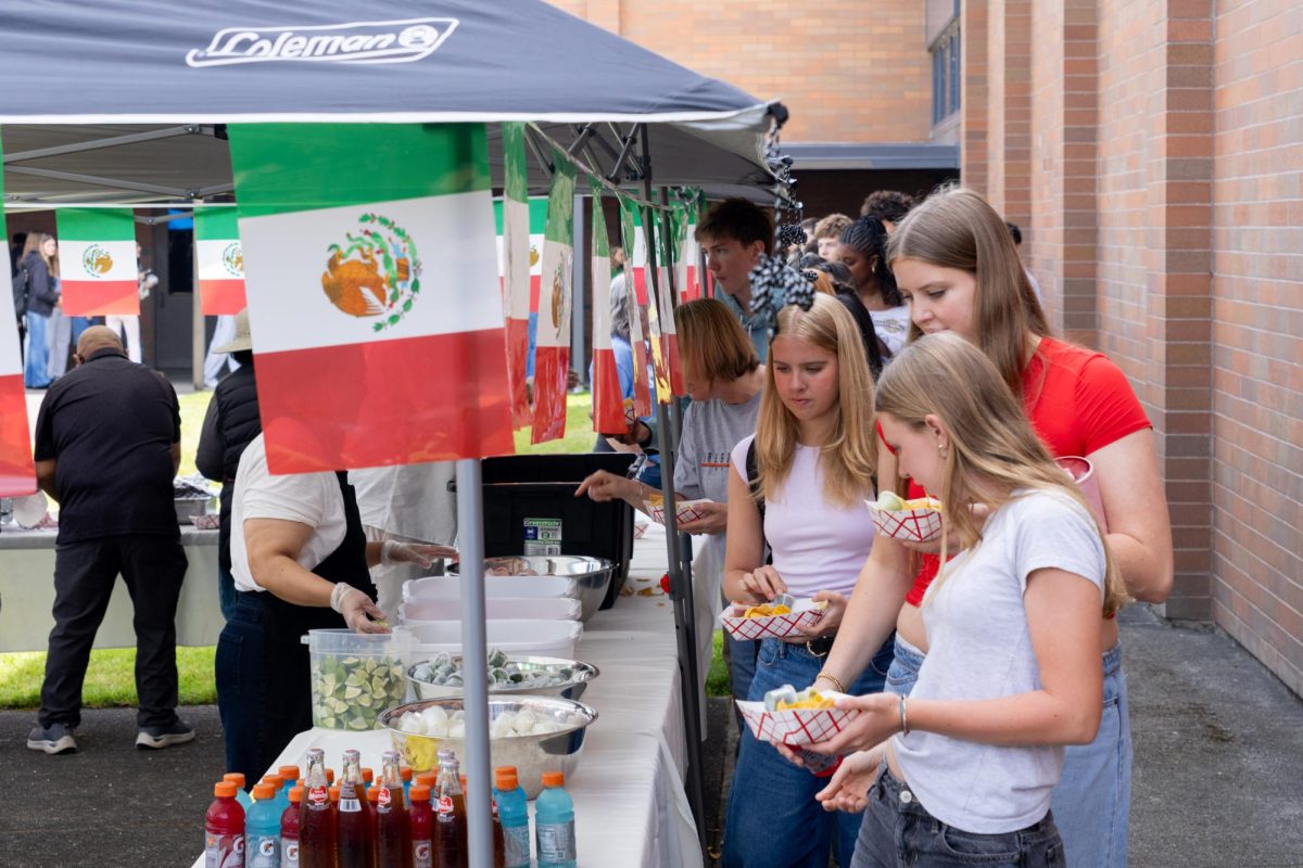 For Friday’s food fair, students received three tickets in their homeroom that allowed them to pick from around 30 different dishes offered by Lasallian families.
